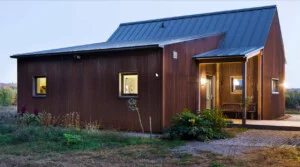 GO Home by GO Logic 1,000 ft² plan B model prefab passive house ADU showing entry porch and exiterior front view.